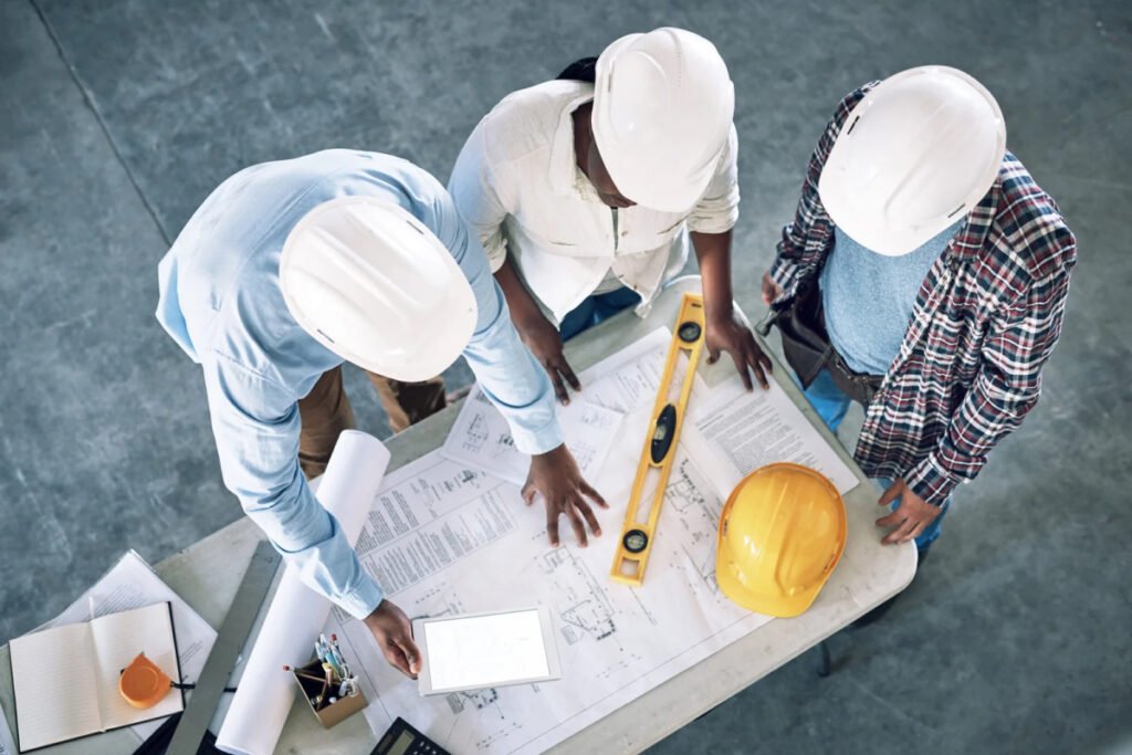 Construction workers reviewing plans