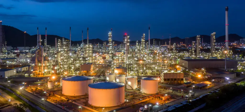 Aerial view oil and gas tank with oil refinery background