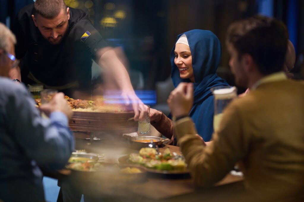 A professional chef serves an European Muslim family