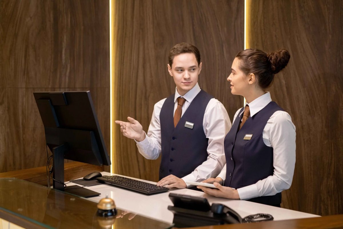 Man & Woman at Hospitality Desk