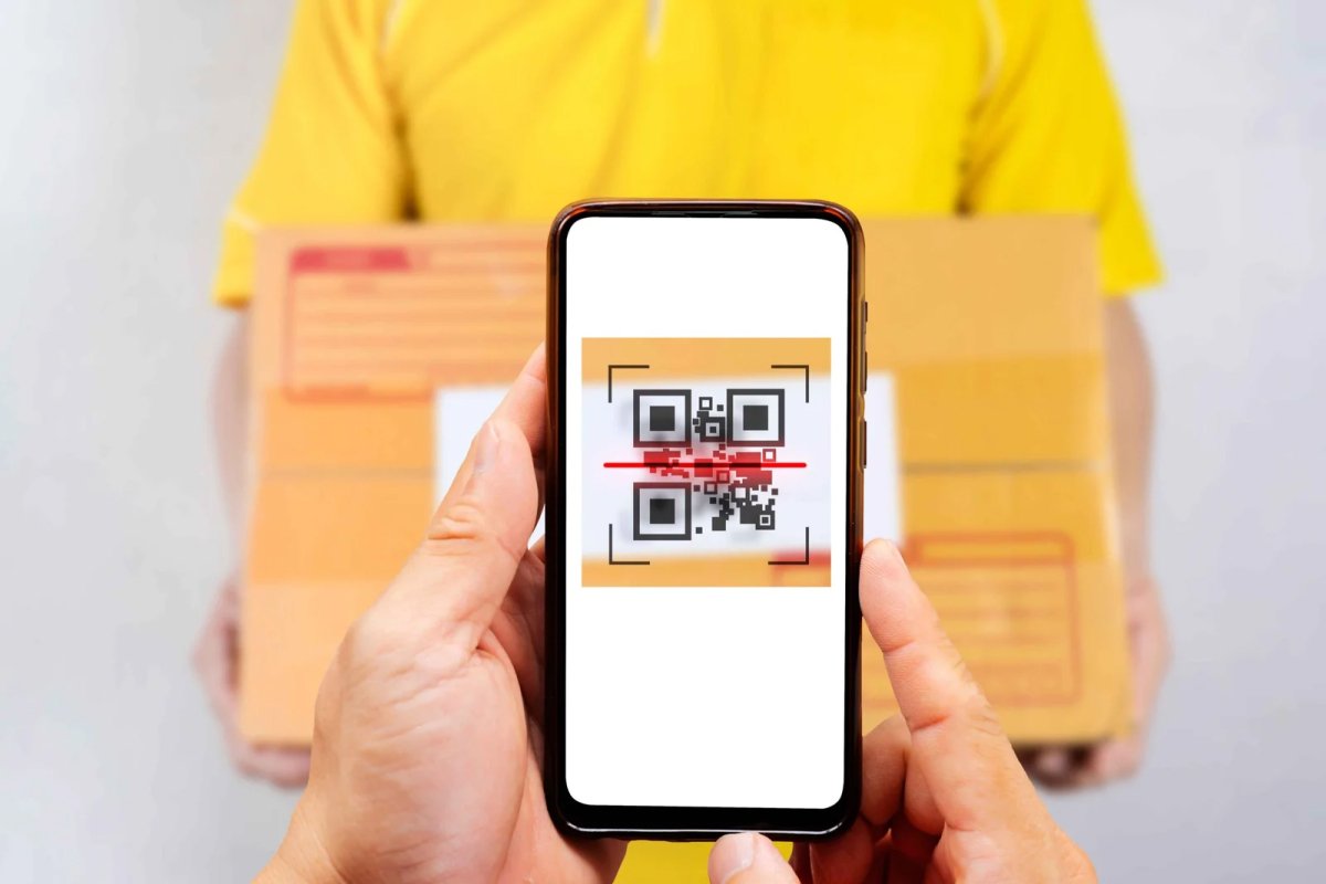 Scanning QR code on delivery package with phone