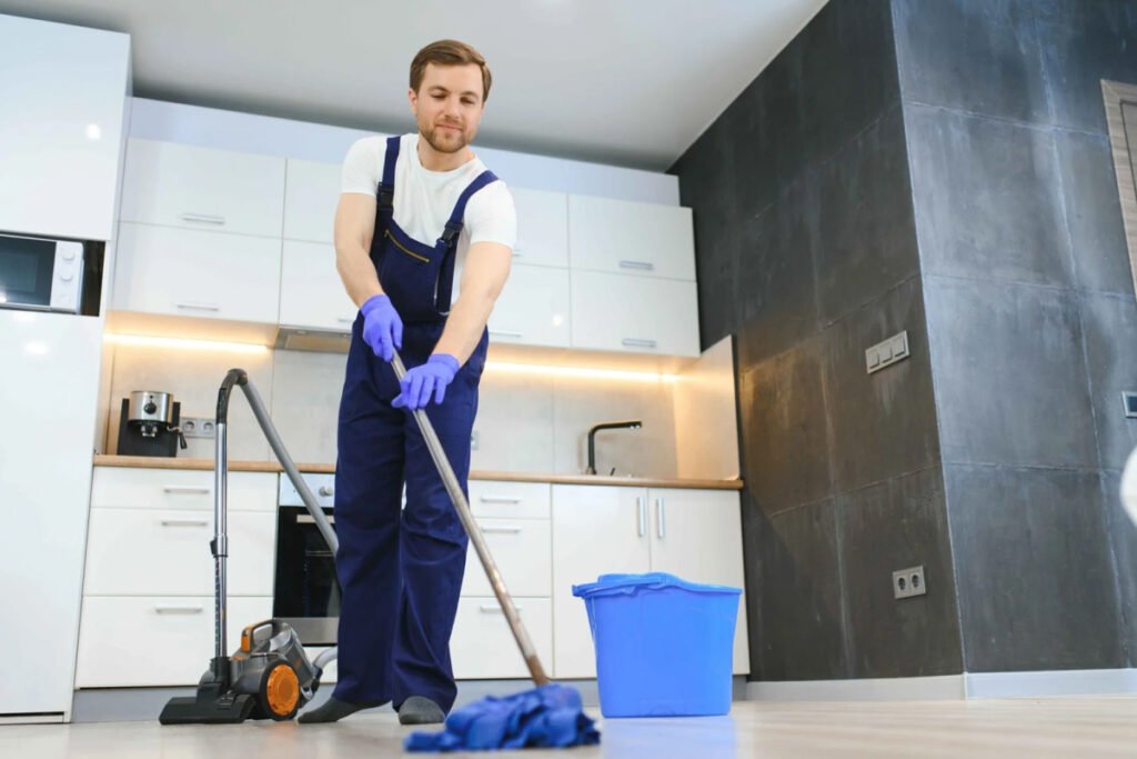 Janitor mops kitchen floor