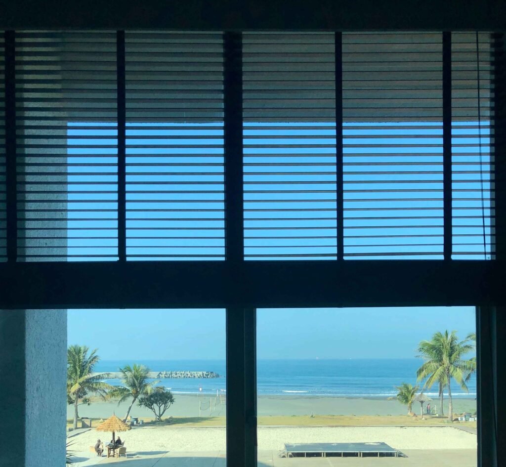 view-beach-seen-through-window